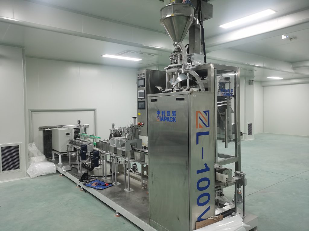 máquina de envasado ao baleiro en po